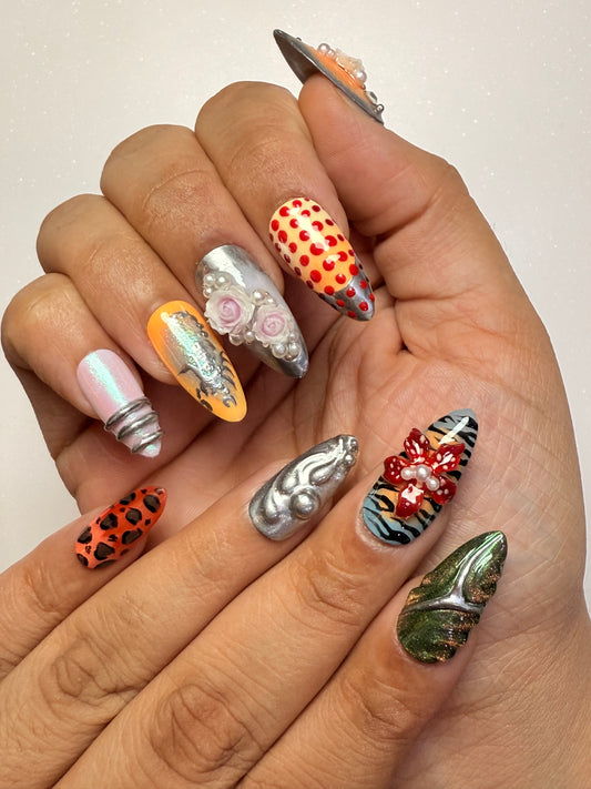 Hand with intricately designed nails on a plain background nail art luxury press-on nail set chrome 3D flower nail set, pearl nails