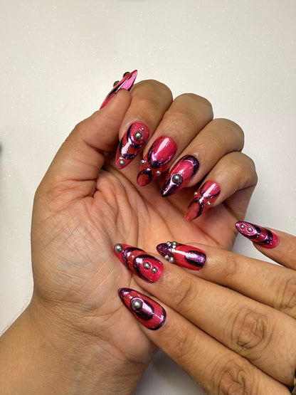 Hand with pink and silver nail art on a neutral background pink chrome nail set abstract nail set 