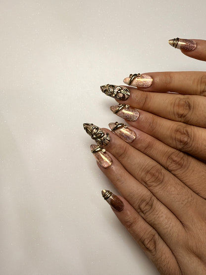 Nails with decorative gold and bronze tips on a plain background brown cat eye press on nail set  3D nail set chrome nail set