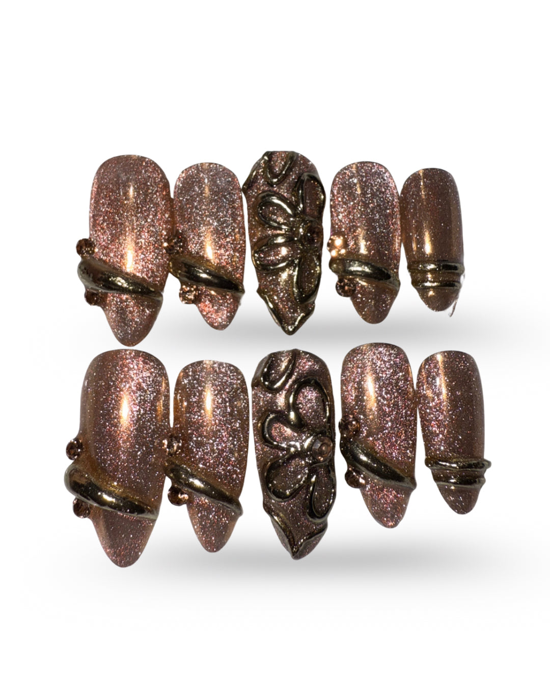 Set of decorative nail art tips with metallic finish on a white background brown cat eye press on nail set  3D nail set chrome nail set