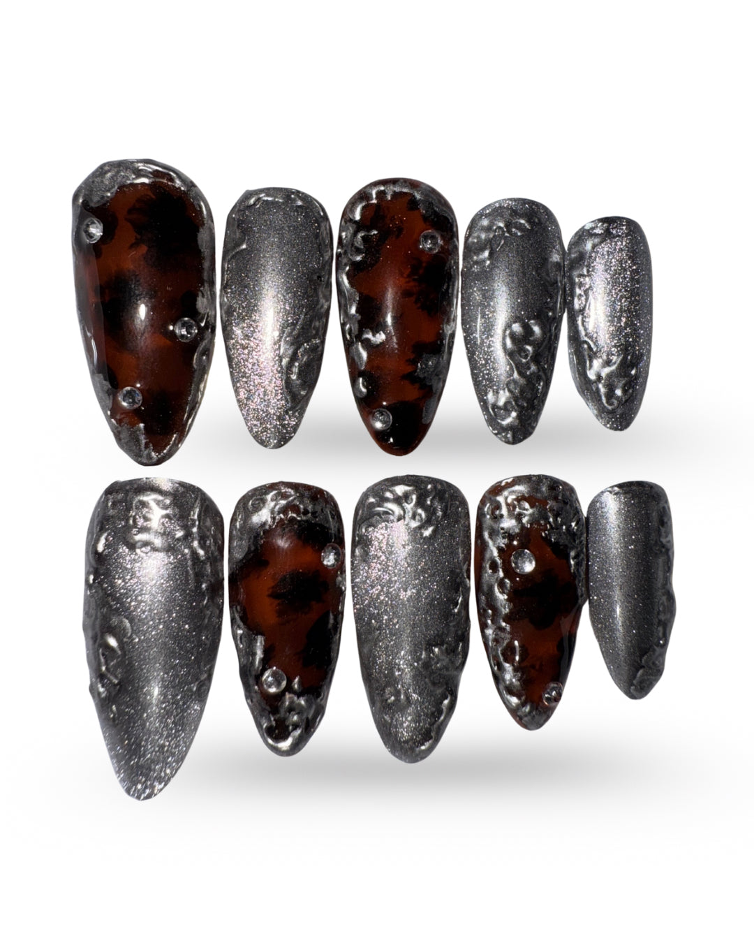 Set of nail art designs with metallic and tortoiseshell patterns on a white background